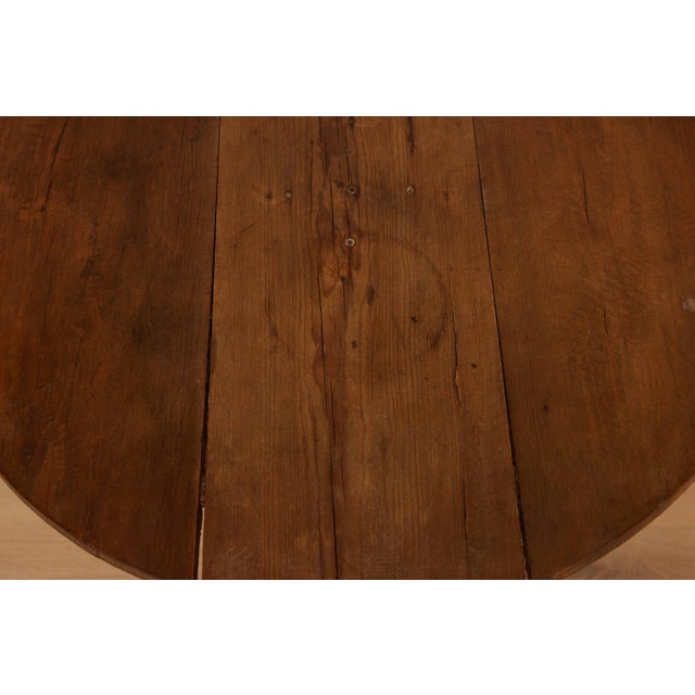 18th C Round French Pedestal Table, with snake legs that is a singular piece that elegantly combines traditional...