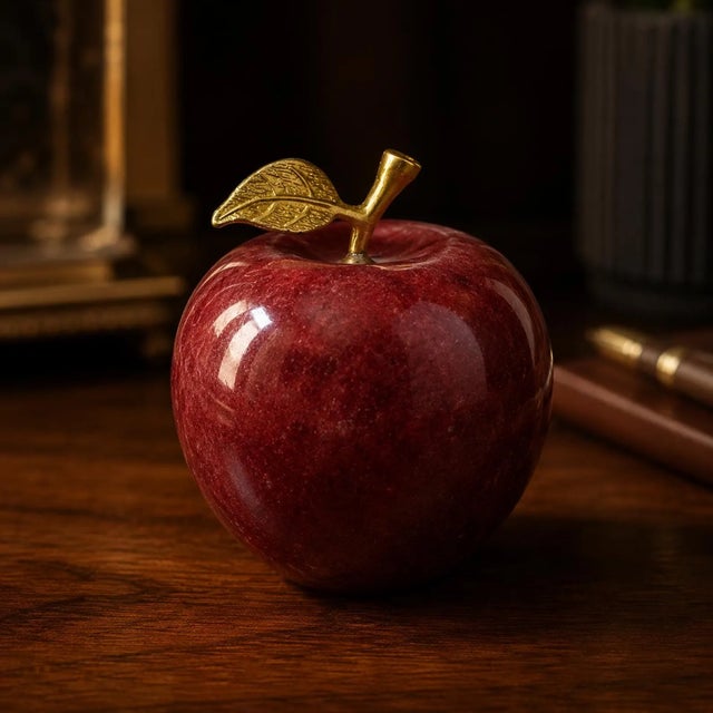 Hand-carved from a single block of genuine Afghan red onyx, this apple is finished with a solid brass stem and leaf. The...