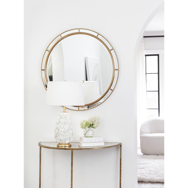 The Plaza Mirror is designed with a round, beveled frame and gold accents. Boasting a modern, art deco aesthetic that's...