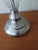 Bring a touch of modern elegance to your space with this beautifully crafted silver and ribbed‑glass table lamp. The base...