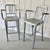 A clean, architectural set of 2 Emeco brushed aluminum stools with arms, combining the brand’s unmistakable industrial...