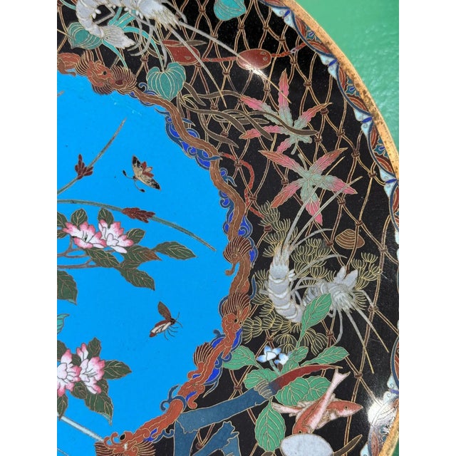 Japanese Cloisonne Charger with Marine Life and Botanical Motifs Japan, Meiji Period, Circa 1890 Diameter: 12 inches This...