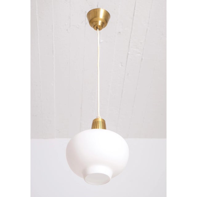 Produced by Ateljé Lyktan, Åhus, Sweden, 1950s. Height is adjustable. This piece is attributed to the mentioned...