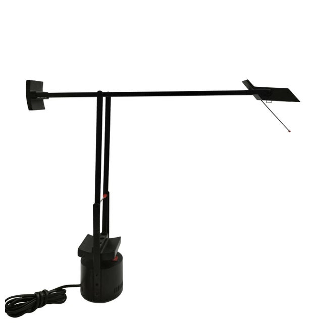 An adjustable table lamp by Richard Sapper for the top brand Artemide. The lamp was made and designed in Italy in 1972. It...