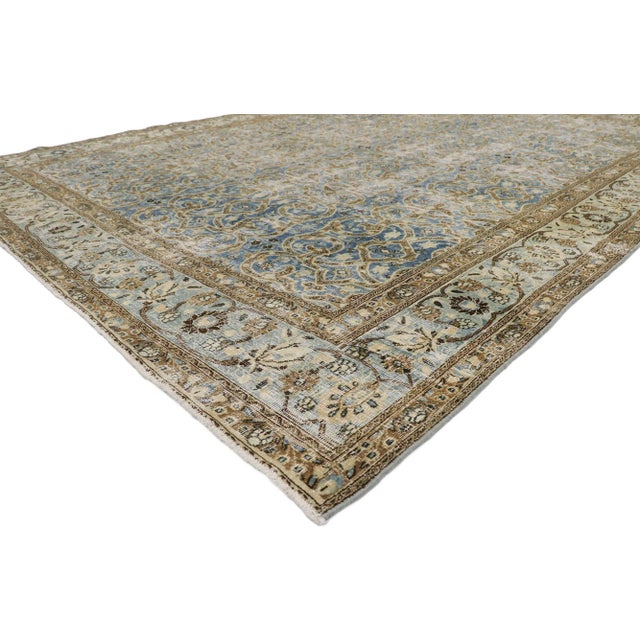 Distressed Antique Persian Mashhad Rug 08'09 x 12'00. Effortlessly chic and emanating coastal vibes with rustic...