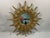 A very glamorous French Style Gilded Resin Sunburst Wall Mirror from the 1960s. This fabulous 16.5" wall mirror features...
