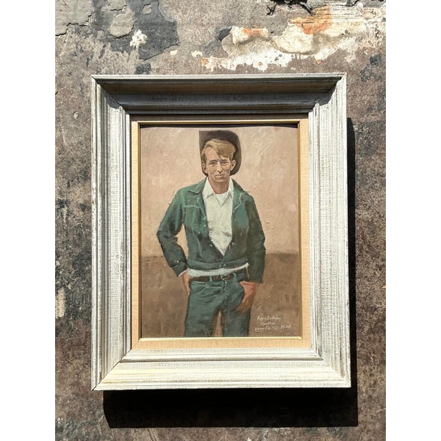 Channel the rugged allure of the American West with this charming vintage oil portrait of a standing cowboy. The painting...