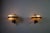 This elegant pair of italian wall lamps from the 1960s beautifully captures the refined materiality and balanced...