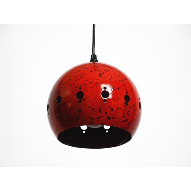 Small beautiful Mid Century Modern red black enameled metal pendant lamp. Shiny, strong red outside and inside with black...