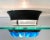 An Italian 1980s Italian ceiling mount light in the Memphis style. 24" reversed frosted glass dish, black enamel mount,...