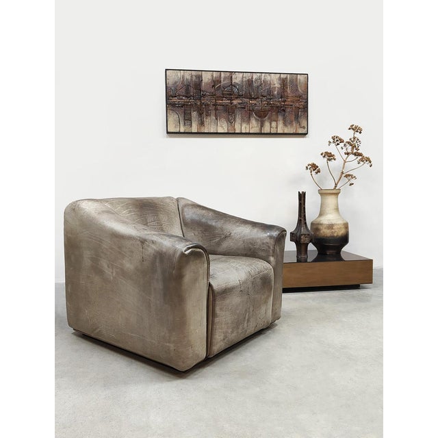 Beautiful, authentic vintage designer leather armchair by De Sede, model DS-47, with a matching ottoman from Switzerland....