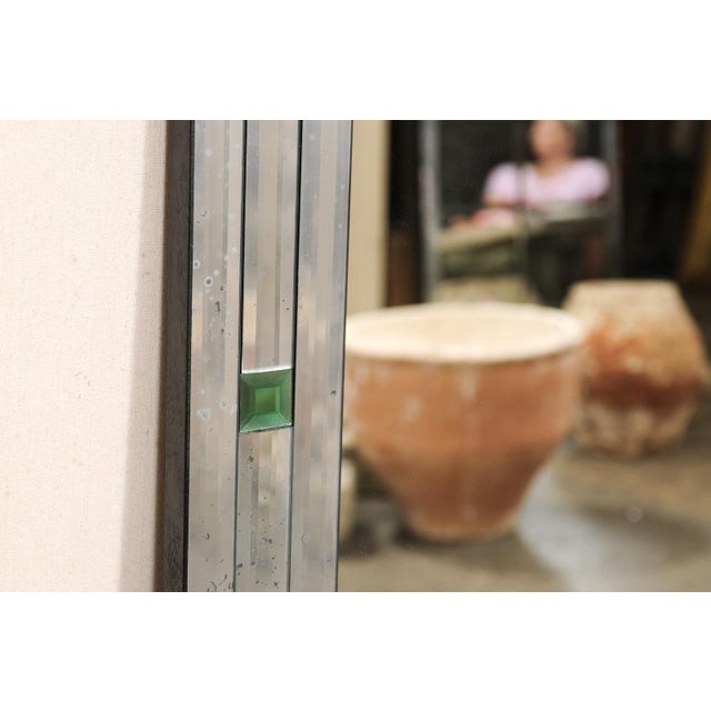 An American artisan crafted, nicely-sized mirror, with green églomisé glass accents and antiqued mirror border. This...