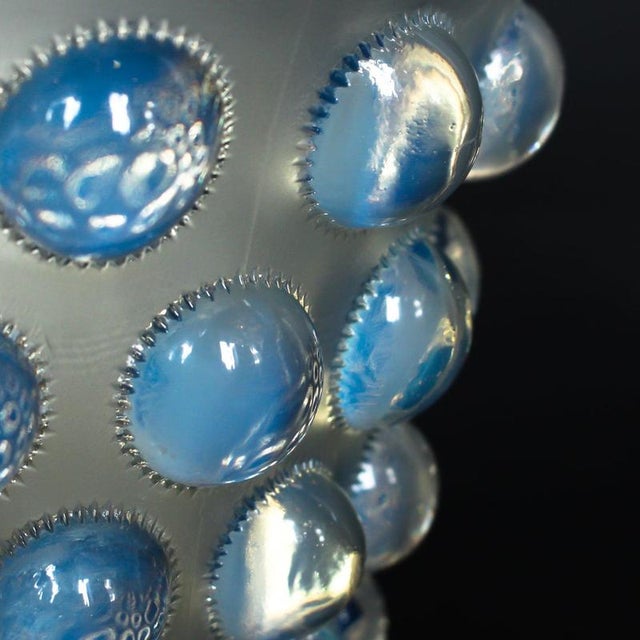 Bammako, an art deco opalescent and moulded glass vase by rené lalique. Relief decorated with raised roundels stencil...