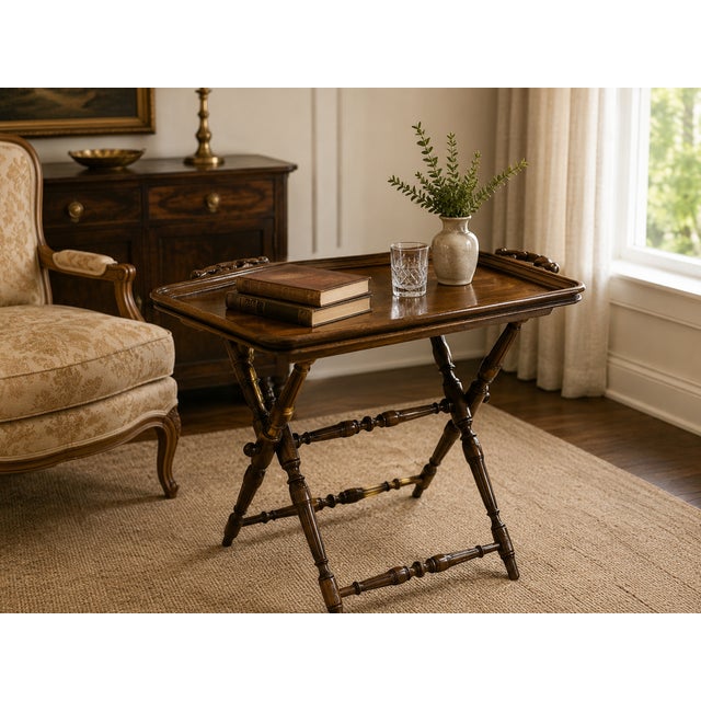 Charming and richly detailed, this 1930s oak butler’s tray table embodies the warmth and craftsmanship associated with...