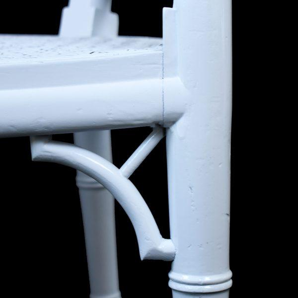 Add breezy elegance with this vintage faux bamboo and cane barrel chair in crisp white. The curved barrel silhouette...