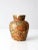 This is a vintage cigar band vase. Adorned with a collage of cigar paper ring bands, the ceramic vase displays a colorful...