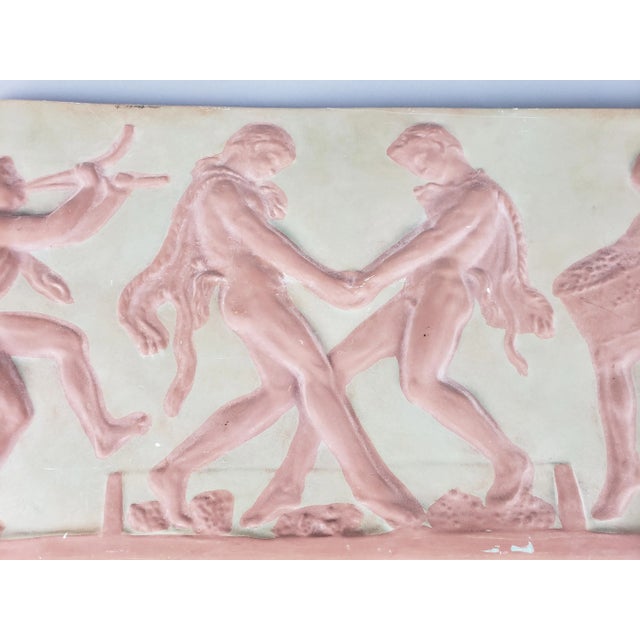 Plaster cast reproduction of a classical frieze. Bacchanalia themed scene. Chip out of bottom left corner.