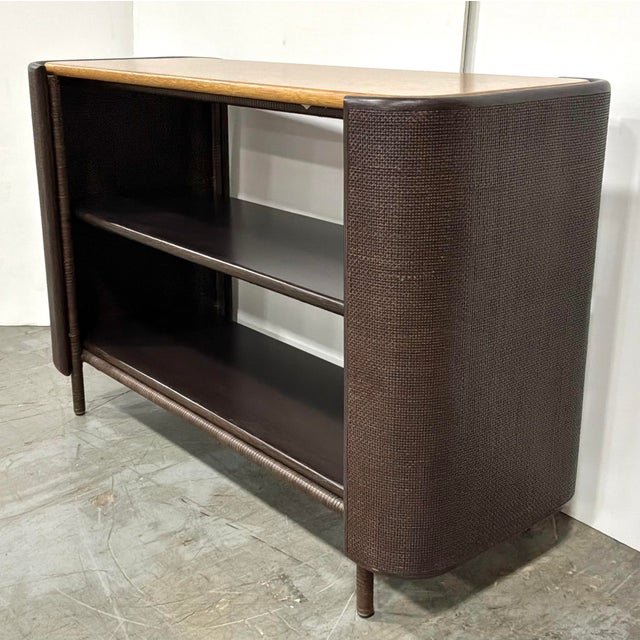 Original retail $6897, stylish Baker / McGuire Organic Modern Chocolate Brown Rattan and Caning Pacific Shelving Unit,...