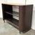Original retail $6897, stylish Baker / McGuire Organic Modern Chocolate Brown Rattan and Caning Pacific Shelving Unit,...