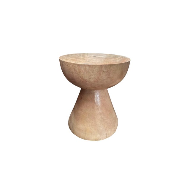 This wonderfully sculptural round side table features a bleached finish, providing a washed out tone to the wood. The...