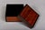 A high-gloss lacquered decorative zebra wood trinket box (for jewelry or other keepsakes) with a matching lid, striking...