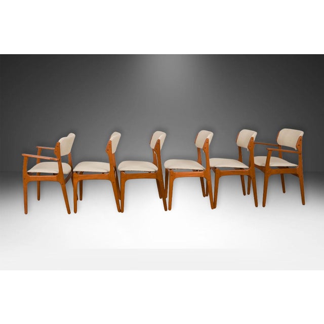 An outstanding set of six beautiful mid century model #49 and 50 teak dining chairs by Scandinavian designer Erik Buch for...