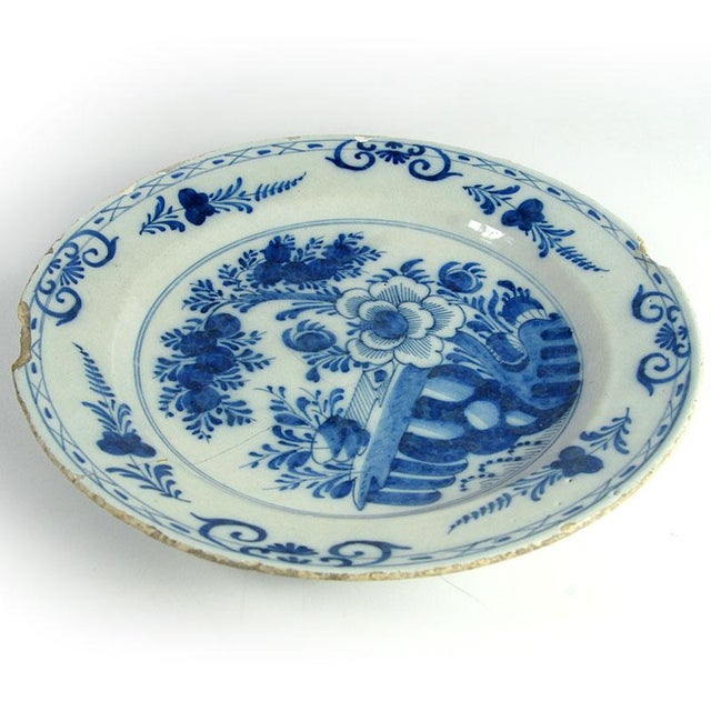 A unique, large, and highly decorative plate. Made of hand-painted faience, it comes from the Dutch Delft factory in the...