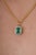 This elegant pendant features a vibrant 1.55 caratCrafted in 14K yellow gold, The emerald measuring 8 x 6 mm, secured in a...