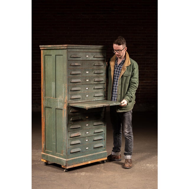 Tall, narrow flat file cabinet in original green painted finish, built for the storage and handling of large-format...