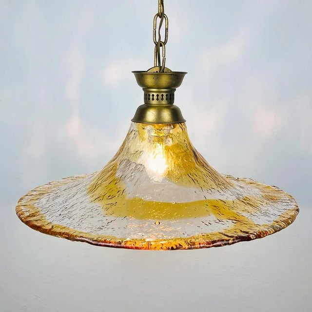 Vintage murano pendant lamp by av mazzega, made in italy in the 1950s. the shade is molded by hand. The lamp also displays...