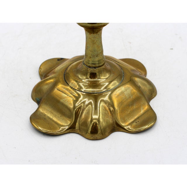Circa 1740-60 George II period brass candlestick. Petal base form with conforming bobeche. Cast in 2 parts. Warm color &...