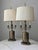 A monumental pair of aged brass table lamps attributed to Frederick Cooper, are an unmatched option and impossible to...