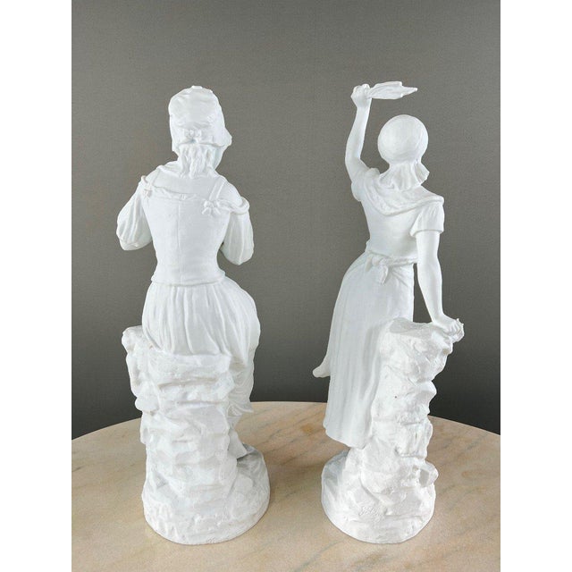 Pair of Biscuit Porcelain Sculptures, Signed G. Lévy (1820-1899), 19th Century An elegant pair of biscuit porcelain...
