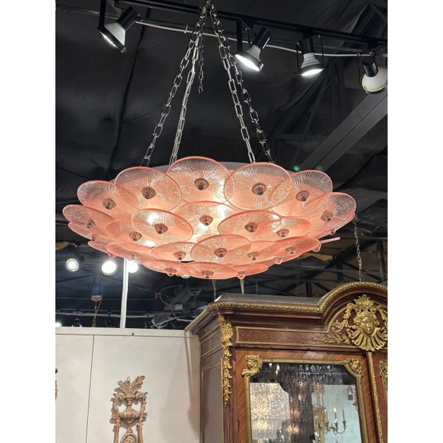 Modern Murano pink disc flush mount chandelier. Circa 2000. The chandelier has been professionally re-wired, cleaned and...