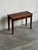 This beautiful accent table features a minimalist rectangular top paired with elegant tapered legs. A single wide...