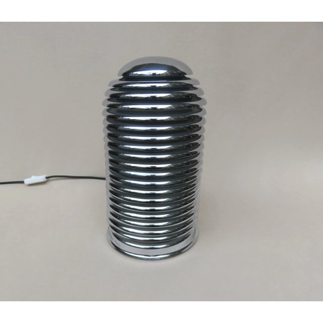 A very rare table lamp "Saturno" by Kazuo Motozawa for Staff from the 70s made of chromed metal. The luminaire has a...