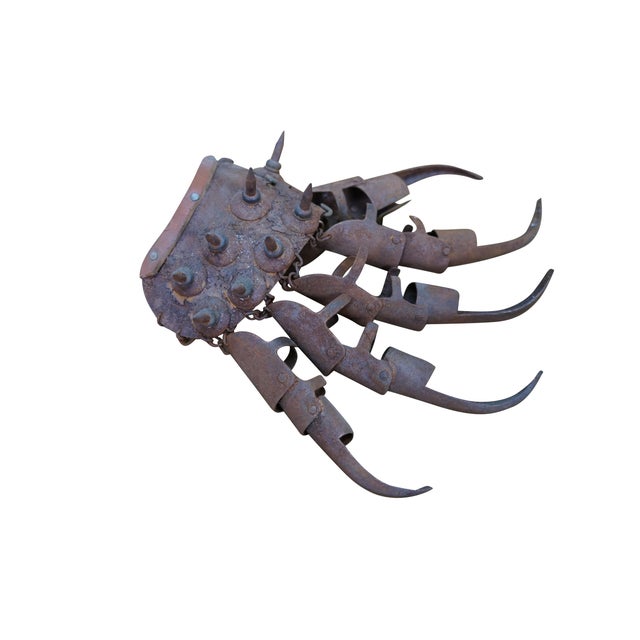 Antique pair of Chinese Tiger Claw or Hawk Combat Gloves. Features a metal articulated frame with spiked wrist plates....