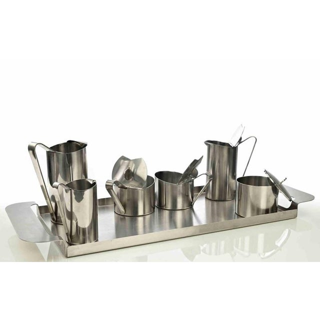 Tea service realized for fratelli carlderoni in 1950s. Made of 18/10 stainless steel and comprising six pieces, bearing...