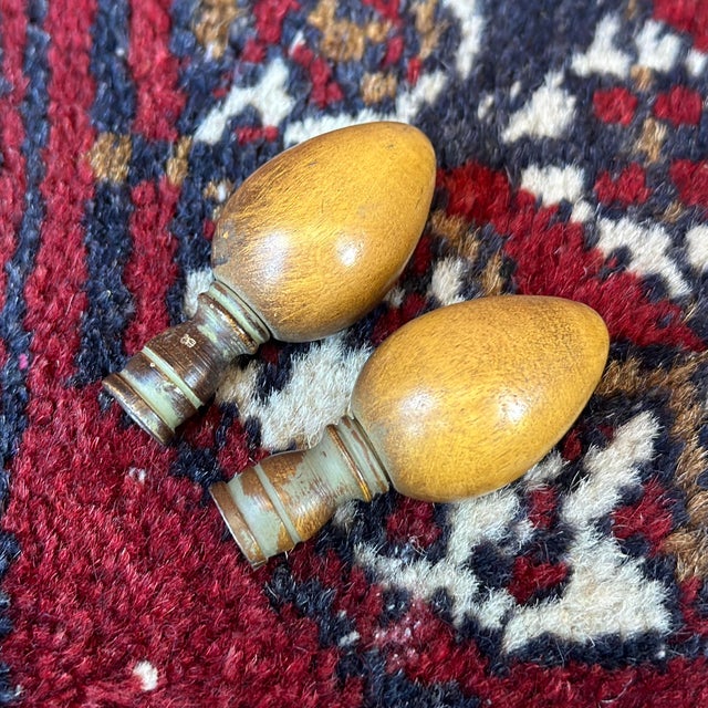 Pair of hard to find mid-century Frederick Cooper lamp finials. Egg or acorn shaped wood on steel base with faux finish....