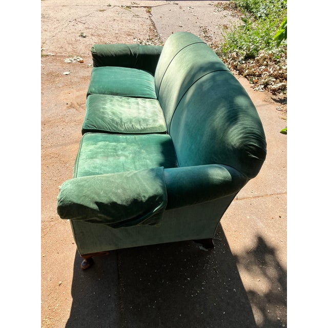 This was my great grandparents' couch, which my mother reupholstered sometime in the 1990s (the material has held up...