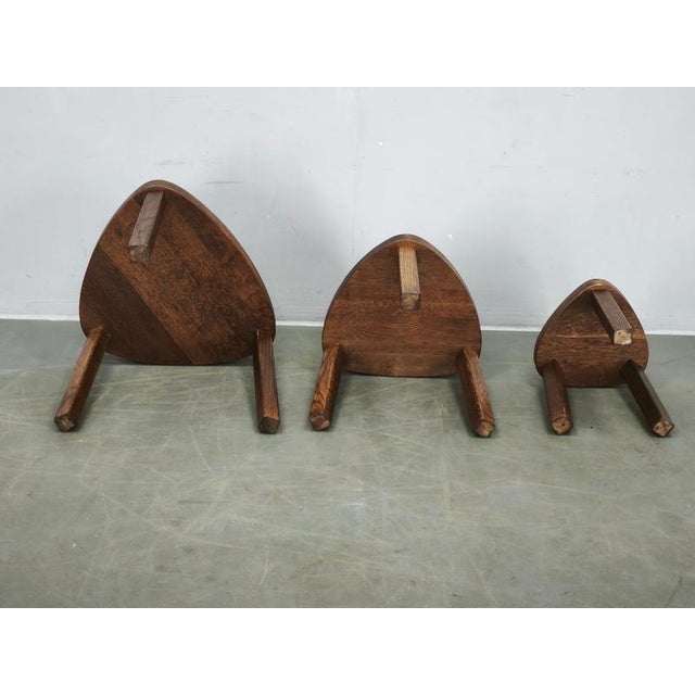 A sculptural set of three Mid-Century Modern nesting tables, produced in Czechoslovakia during the 1960s and crafted...