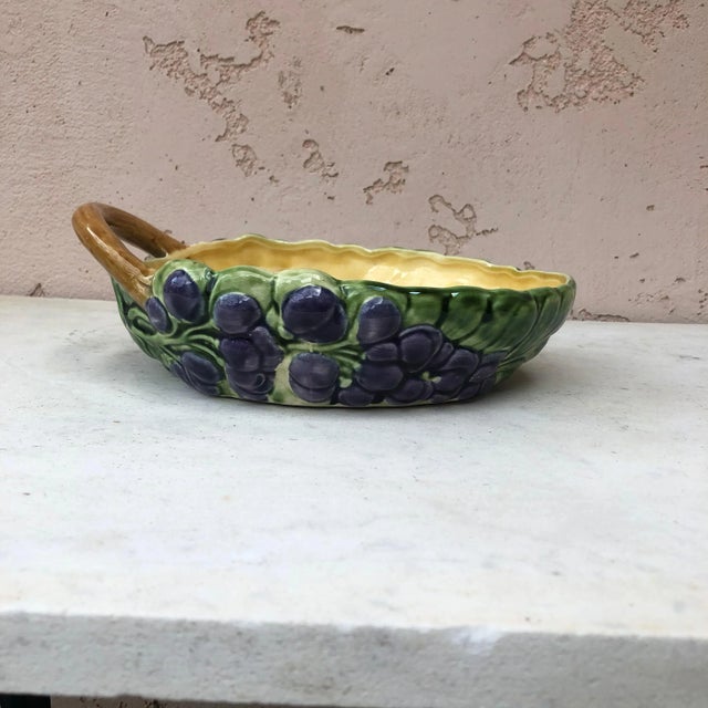 Majolica handled basket with purple flowers signed Sarreguemines, circa 1900.