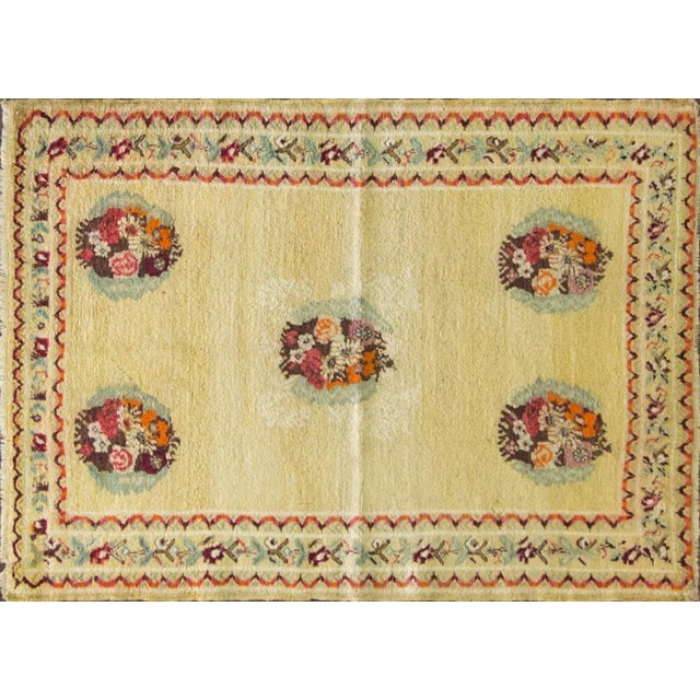 This delightful antique Oushak rug is a particularly charming example of early 20th-century Anatolian weaving. The design...