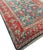 This antique Turkish Oushak rug, hand-knotted and dating back to circa 1890, features central floral motifs highlighted...