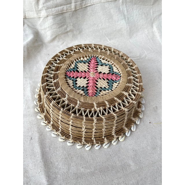 Vintage Woven Seagrass/Raffia Bowl w/Sea Shell Trim and Embroidered bottom detail in soft pink and lavender. These type of...