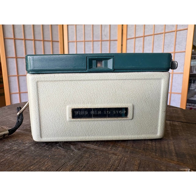 Vintage Kodak Hawkeye Instamatic Camera in original sage green and cream colorway. This classic mid-century camera was...