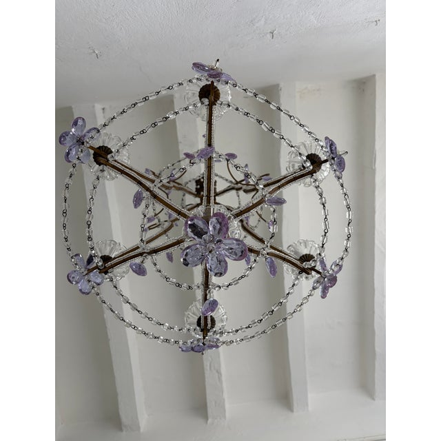 Housing six-lights, sitting in crystal bobéches. Will be re-wired with certified UL US sockets for the USA and appropriate...