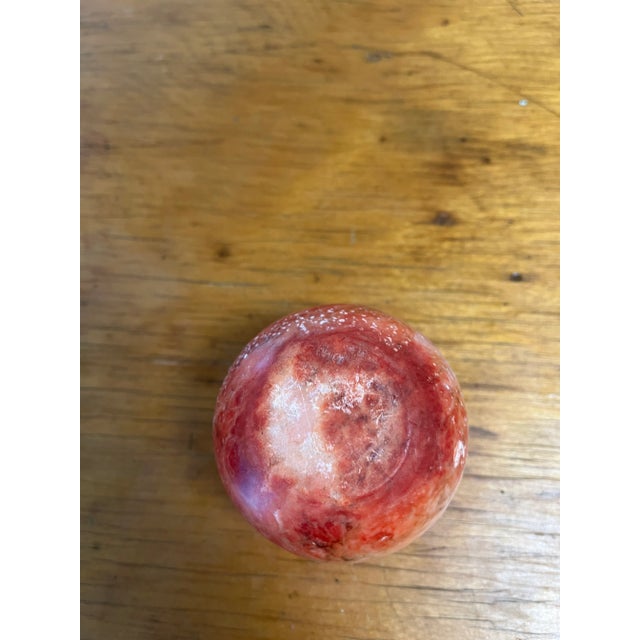 Vintage 80s/90s post modern decorative object /round marble paperweight. Natural stone is red with white/cream highlights...