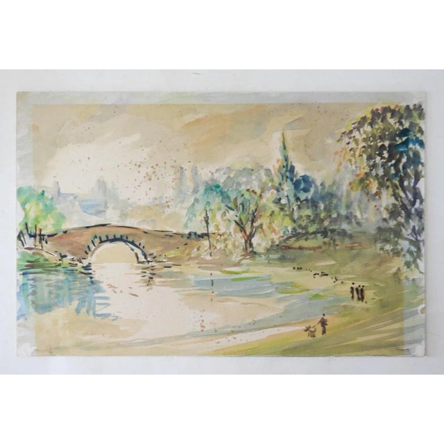 Watercolor on paper French School riverside landscape with stone bridge. Unsigned. Unframed, mounted on cardboard backing,...