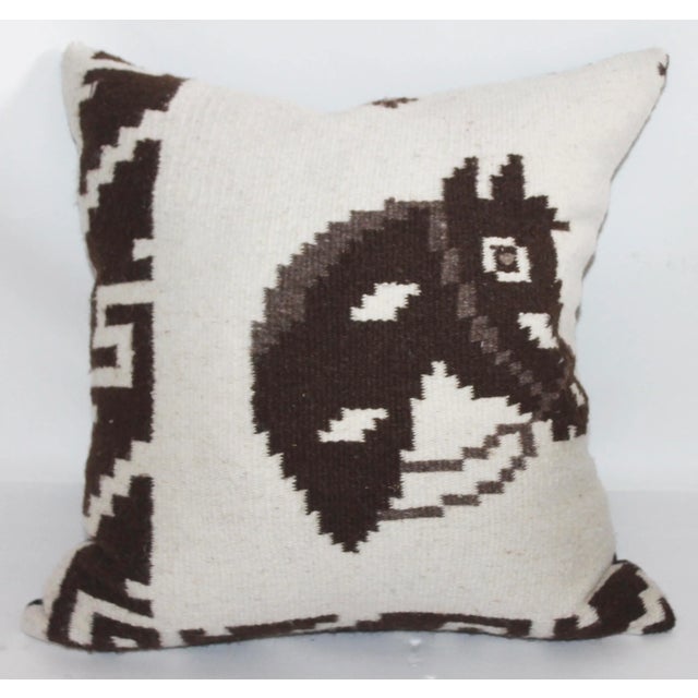 Wool hand woven horse pillow with linen backing, down and feather insert and zipper closure on bottom. This item has been...